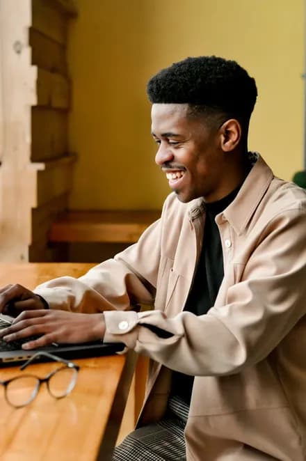 Customer completing an online purchase on a laptop