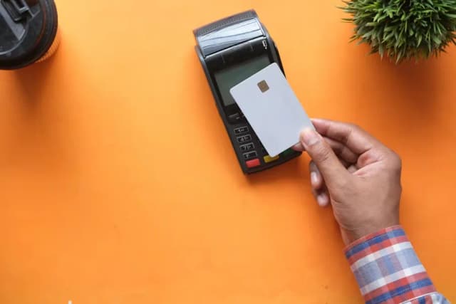 Customer completing a card payment on a terminal